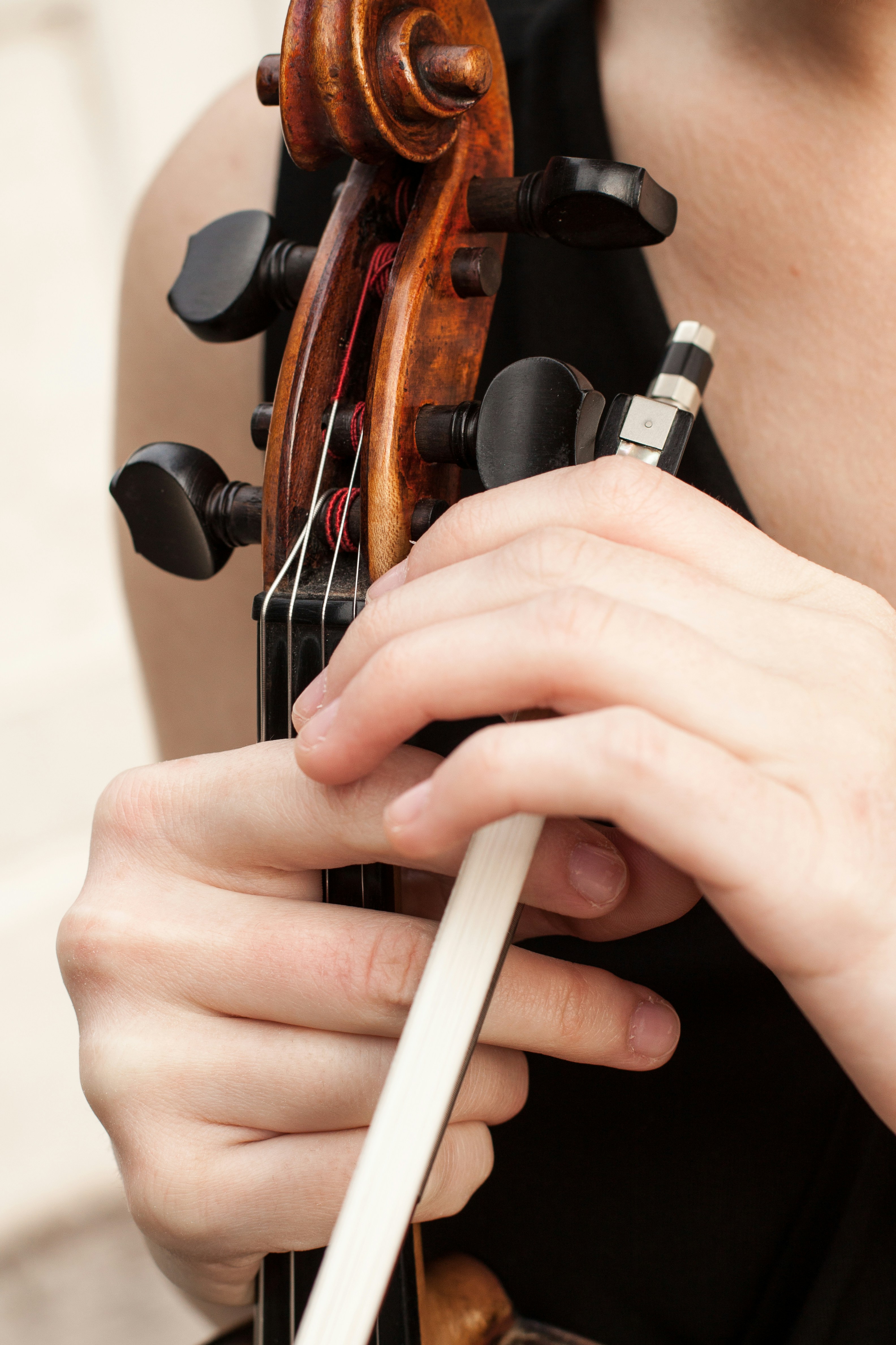 Close view of a violin and the musician’s hands